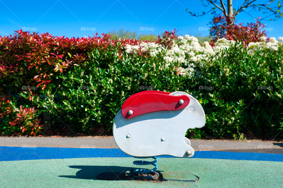 Rabbit springy swing in playground.