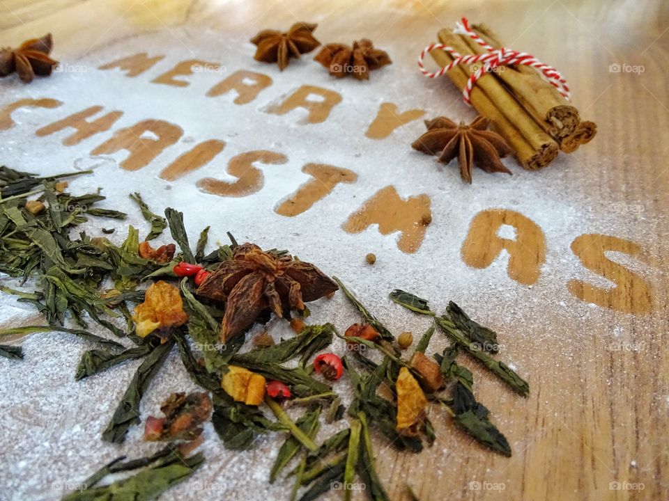 Writing merry christmas with powdered sugar