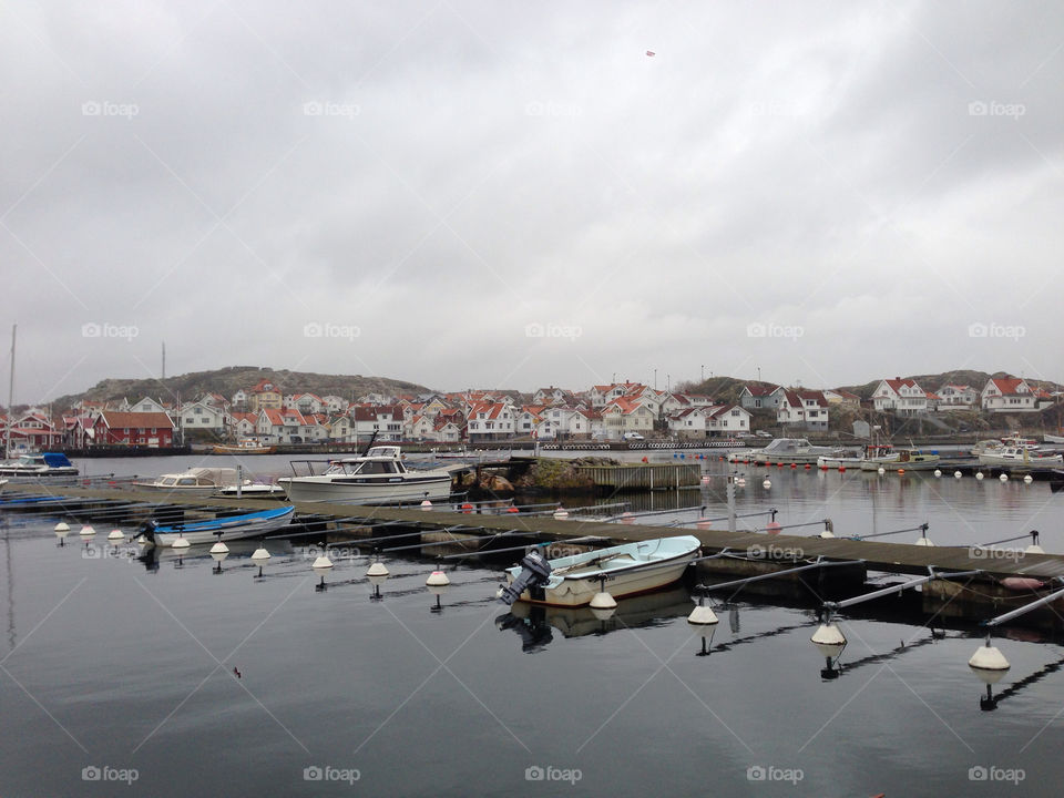 boats sea houses village by haq