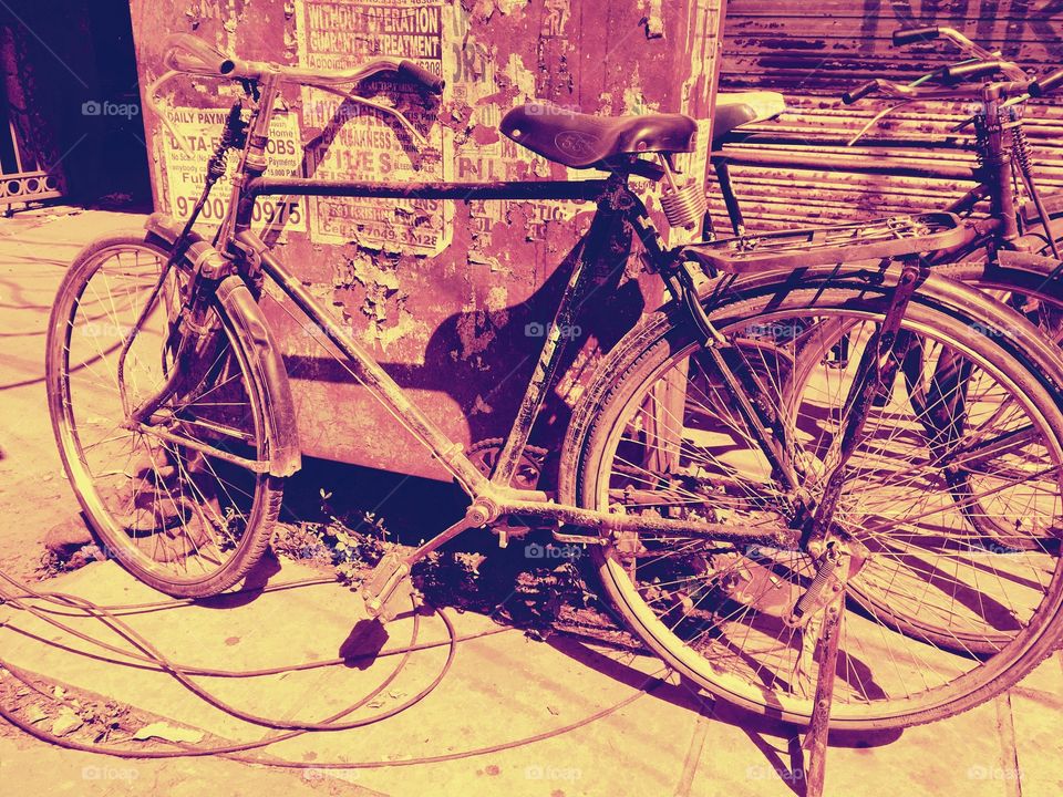 Old bicycle kept on roadside to catch up some tea by commuter