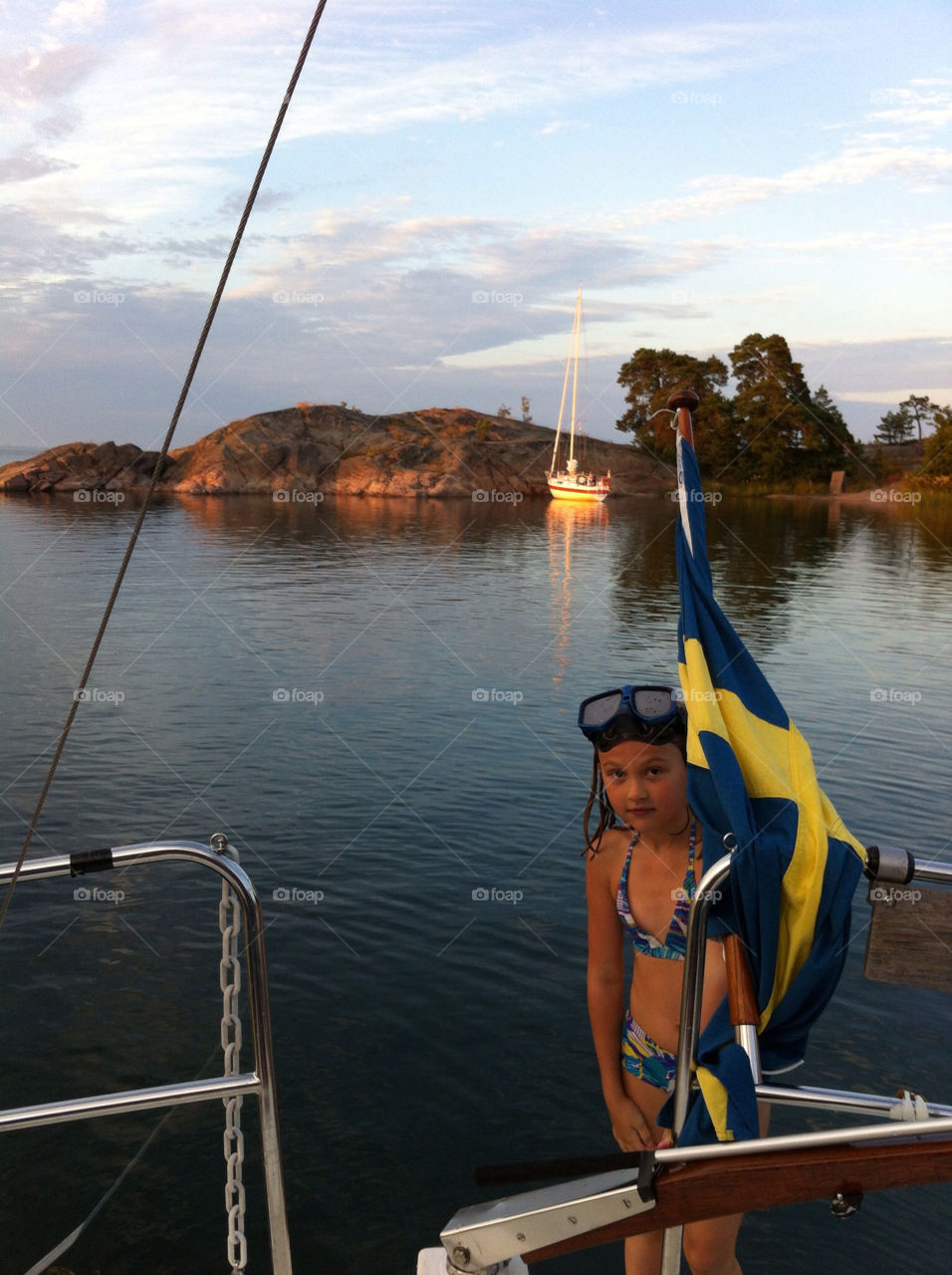 Evening bath before dinner on our sailing boat. On Skogsvartskär on