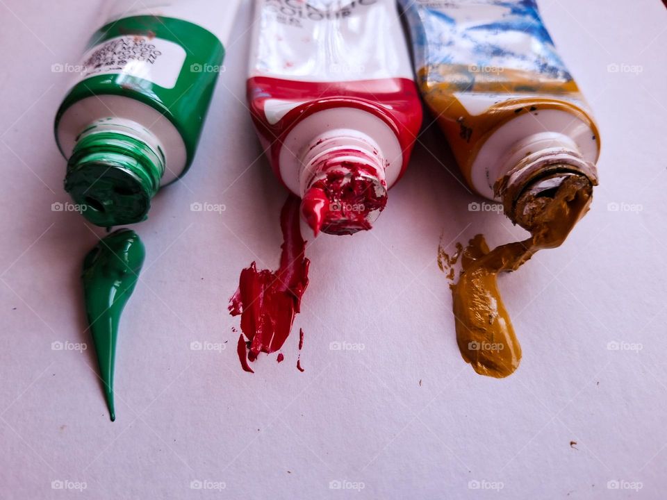 multicolored acrylic paint on a white canvas background