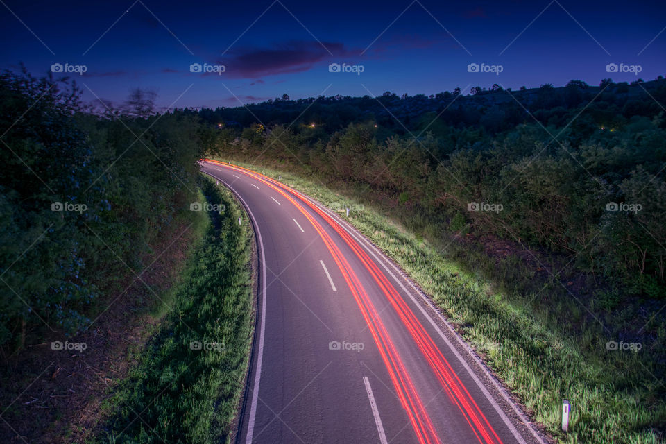 road at night with lighttrails