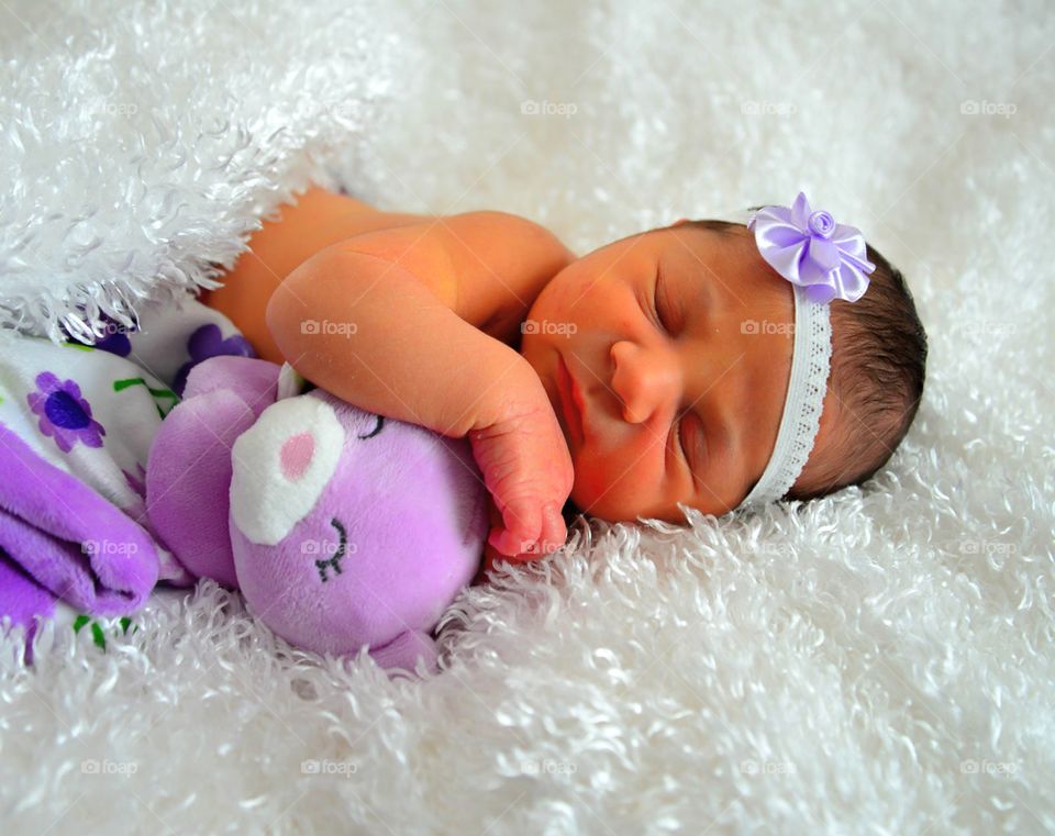 Adorable newborn. stuffed bear and baby girl