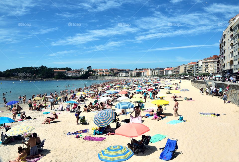 Busy beach in Sanxenxo, Galicia, Spain.