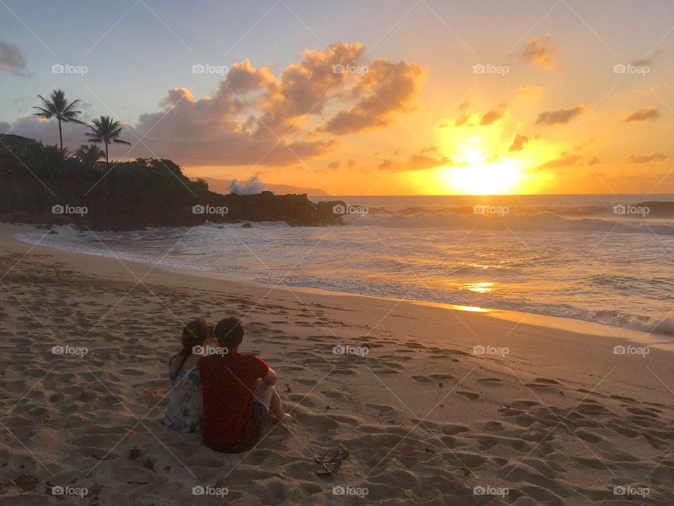 Couple on the beach at sunset