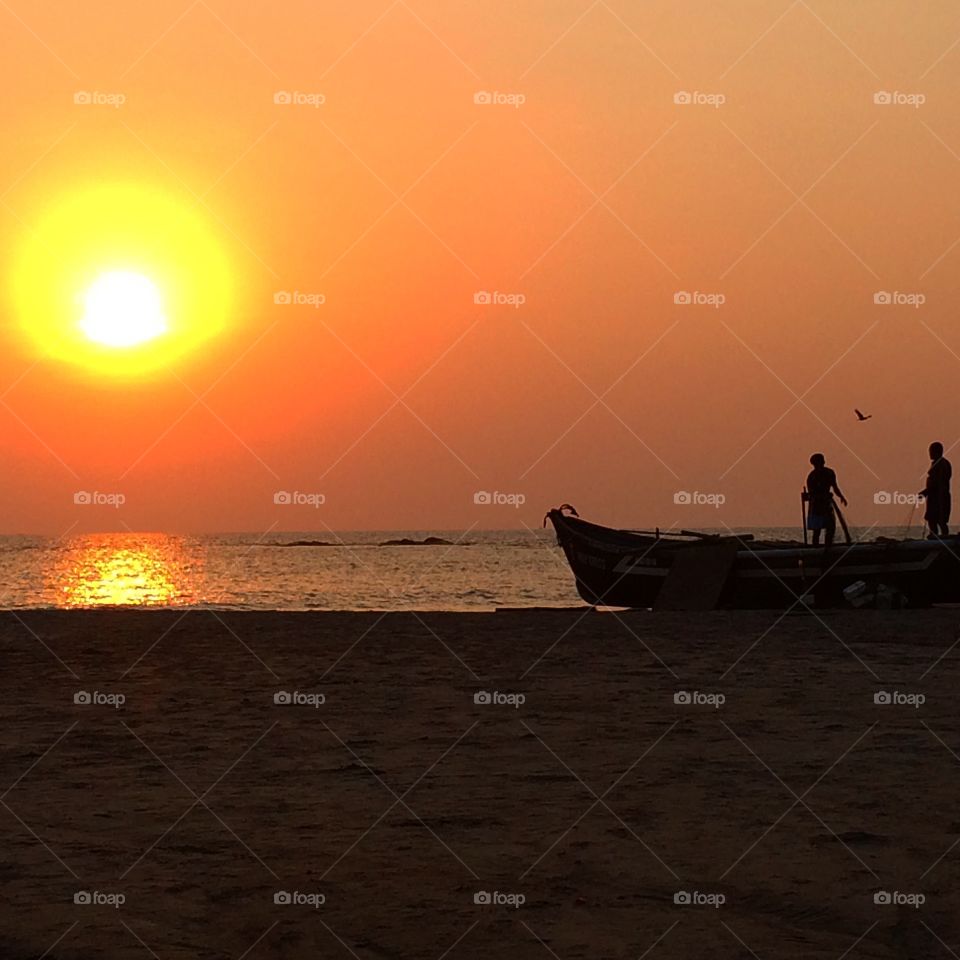 Silhoutte of goan fishermen . Goan fishermen are preparing for a night fishing