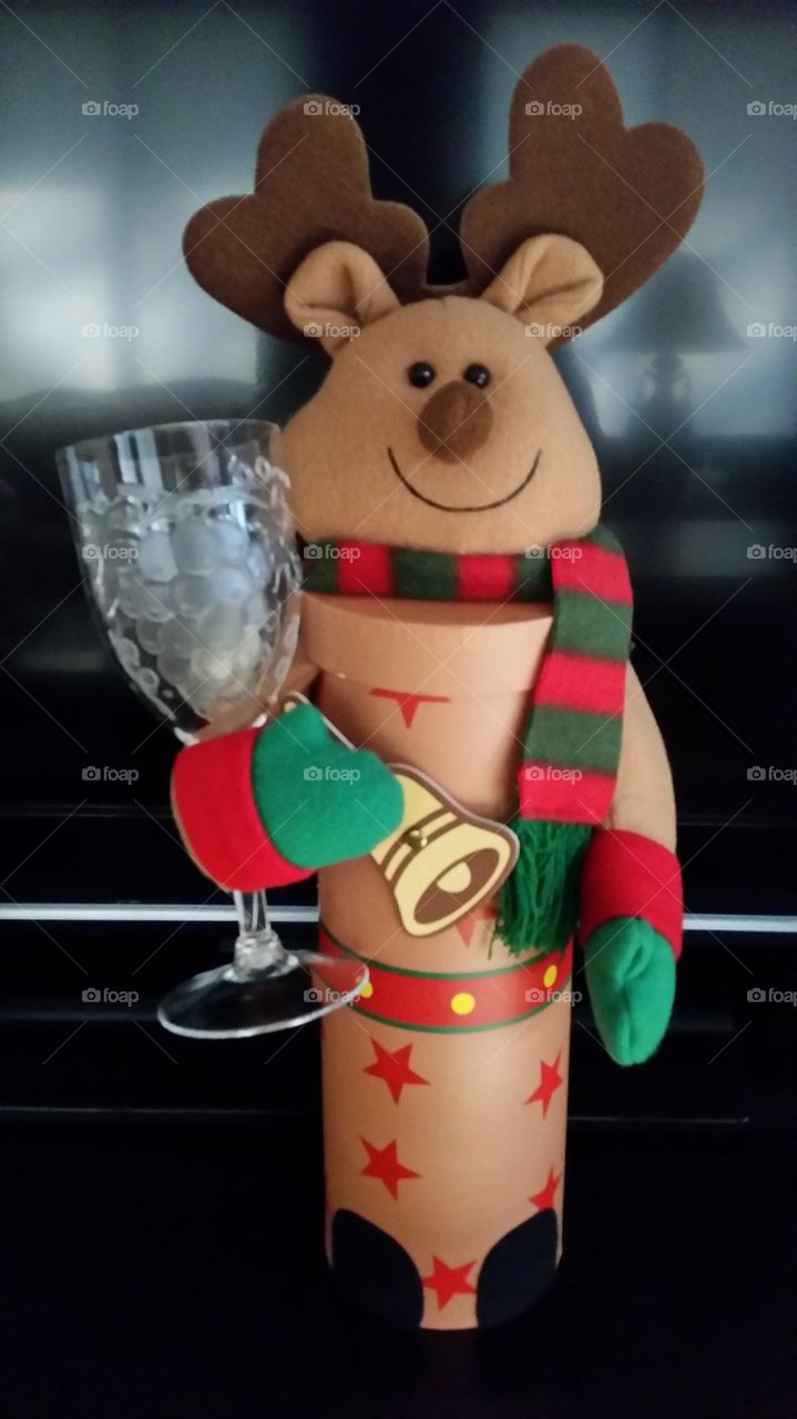 Cheers!. Holiday reindeer bottle holder with wine glass.