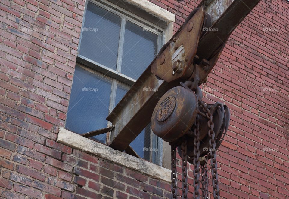 Vintage pulley system. Rusted chains