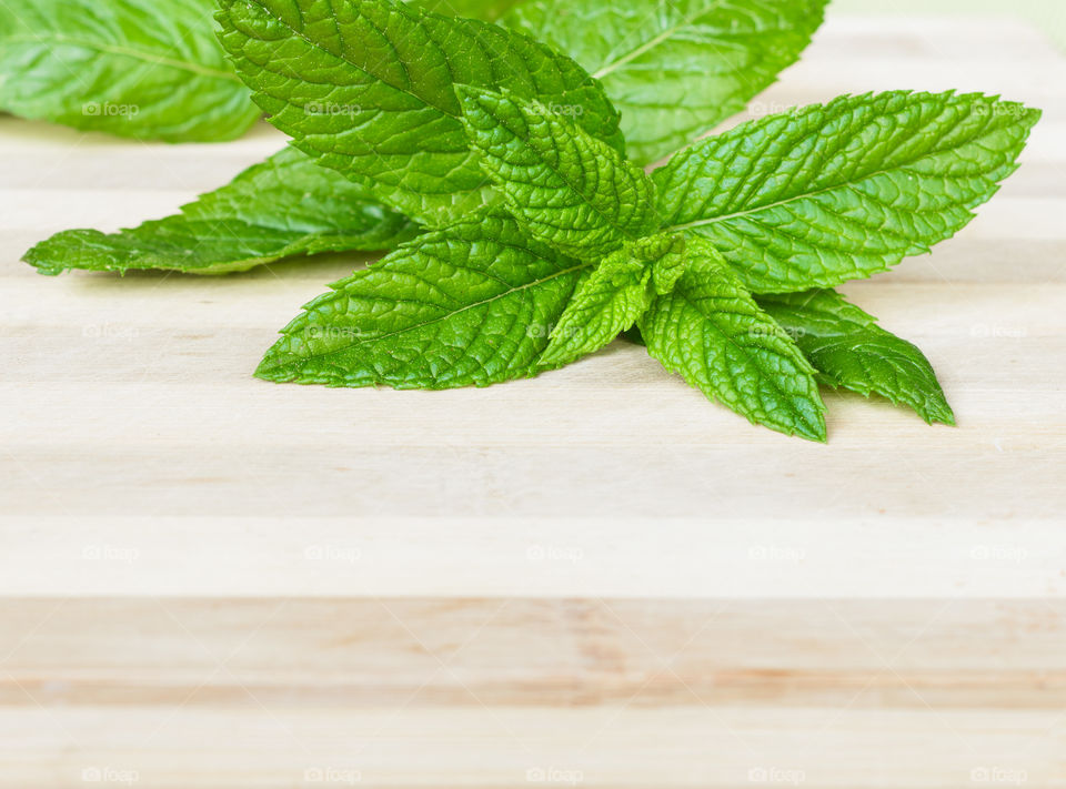 Mints on wooden background 