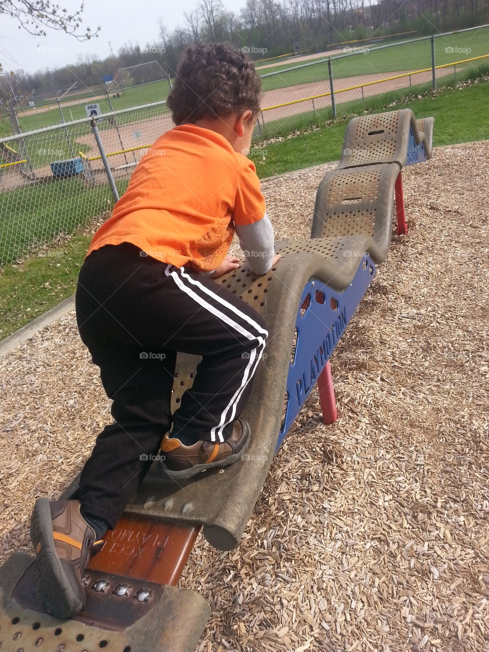 playmotion at playground. boy on playmotion at playground