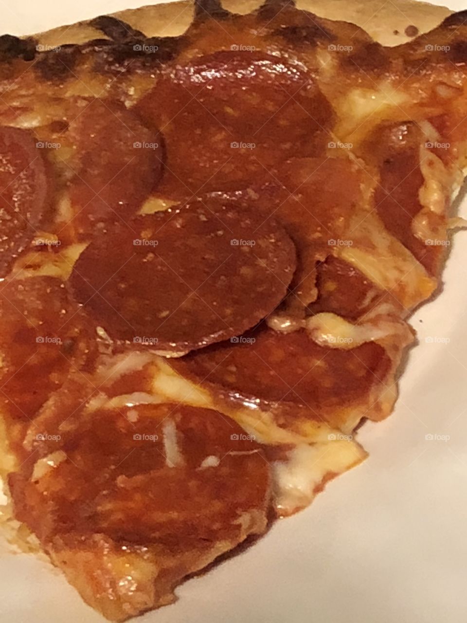 Pepperoni pizza slice