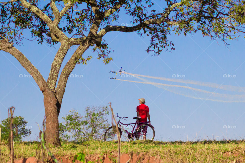 Farmer watching the airshow