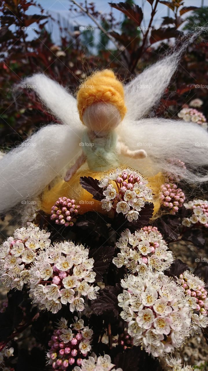 A fairy between the flowers