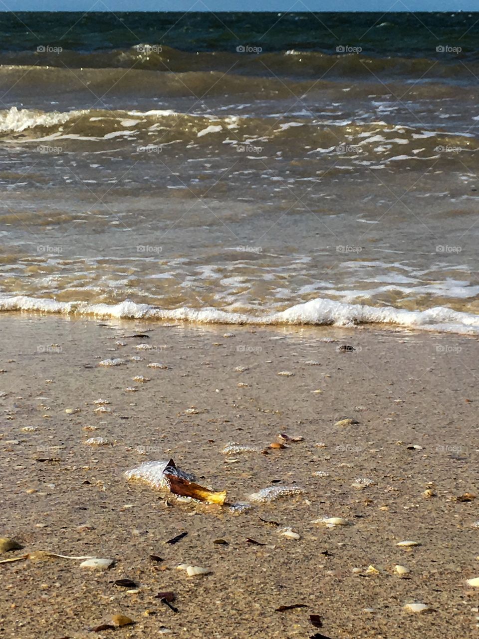 Ground shot of ocean, sand, beach, waves, water south Australia perfect for background image or inspirational message 