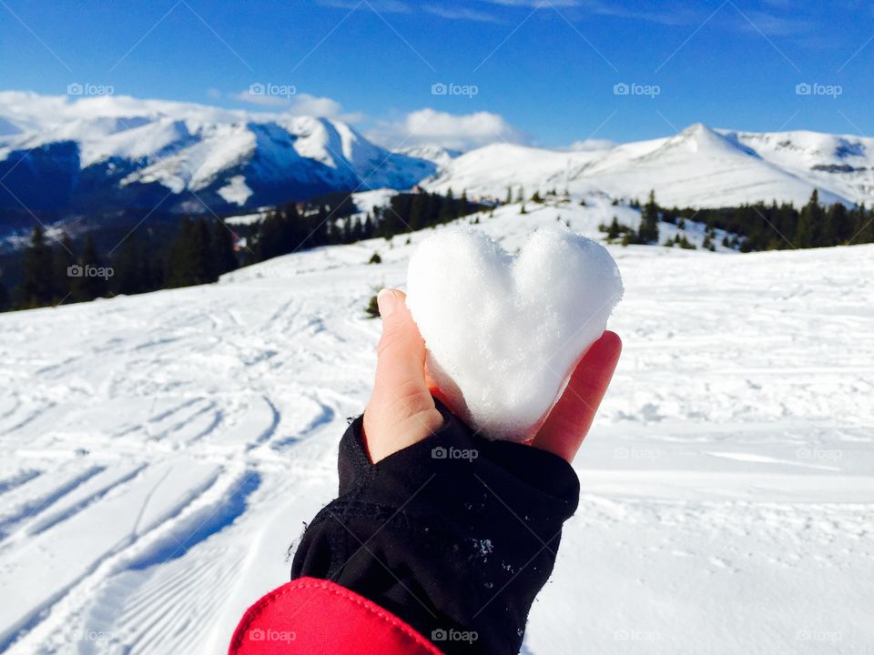 hand holding Snow heart