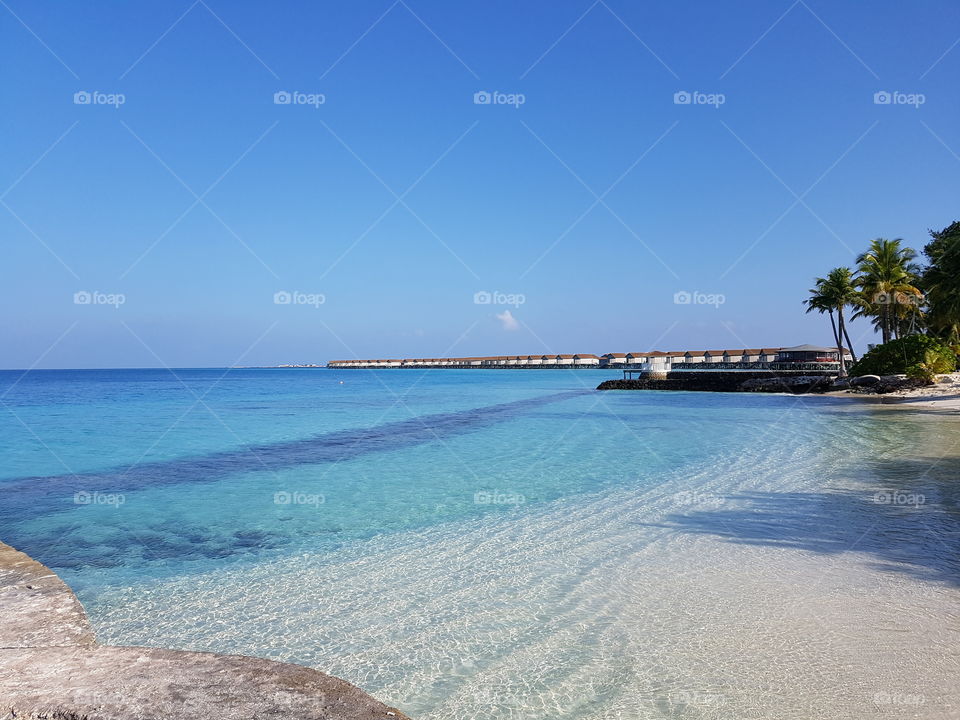 Blue sea and white beach at Maldives