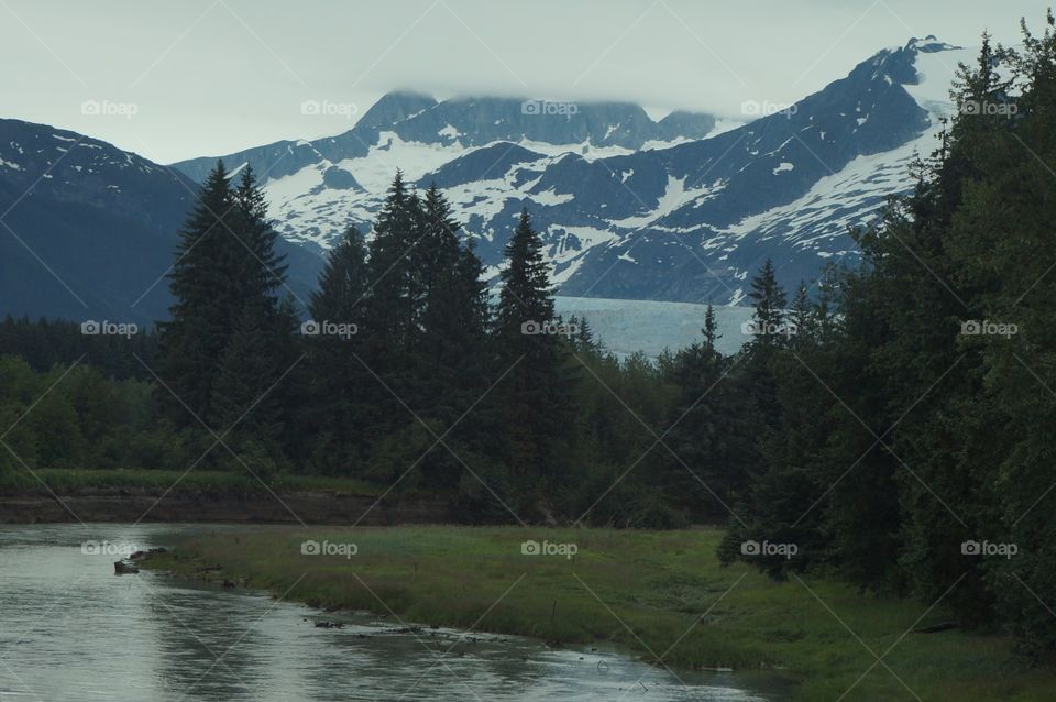 Nature at work in Alaska.  Forest, River, Mountains, Sky and Glacier.  Alaska