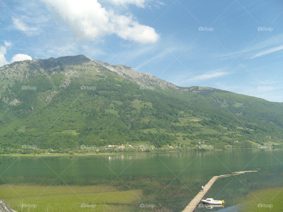 Lake Plav Montenegro landscape with green fields in summer