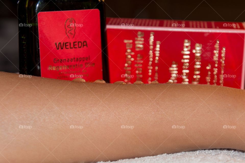 Drops of weleda oil on a arm