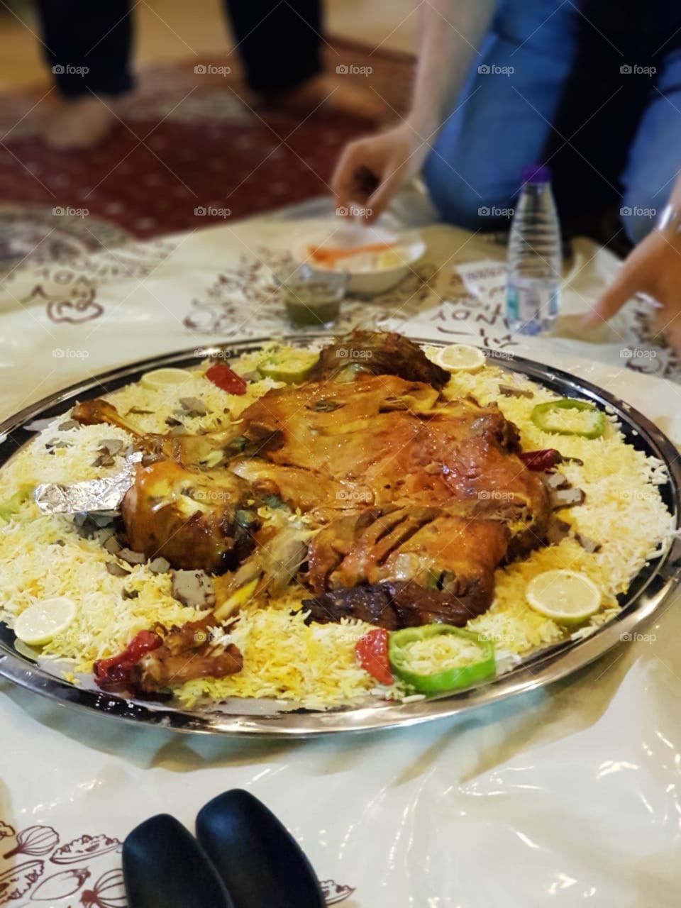 Laham Mandi or Lamb Mandi is a Saudi Arabian Traditional dish which is also very popular in other middle eastern countries like United Arab Emirates, Qatar, Kuwait, Oman and yemen. Serving in a huge plate is called "Dhabiha" or sacrifised :).