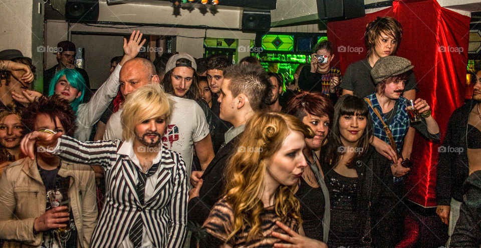 Crowd of people dancing in the Tubman pub, in Hastings UK 