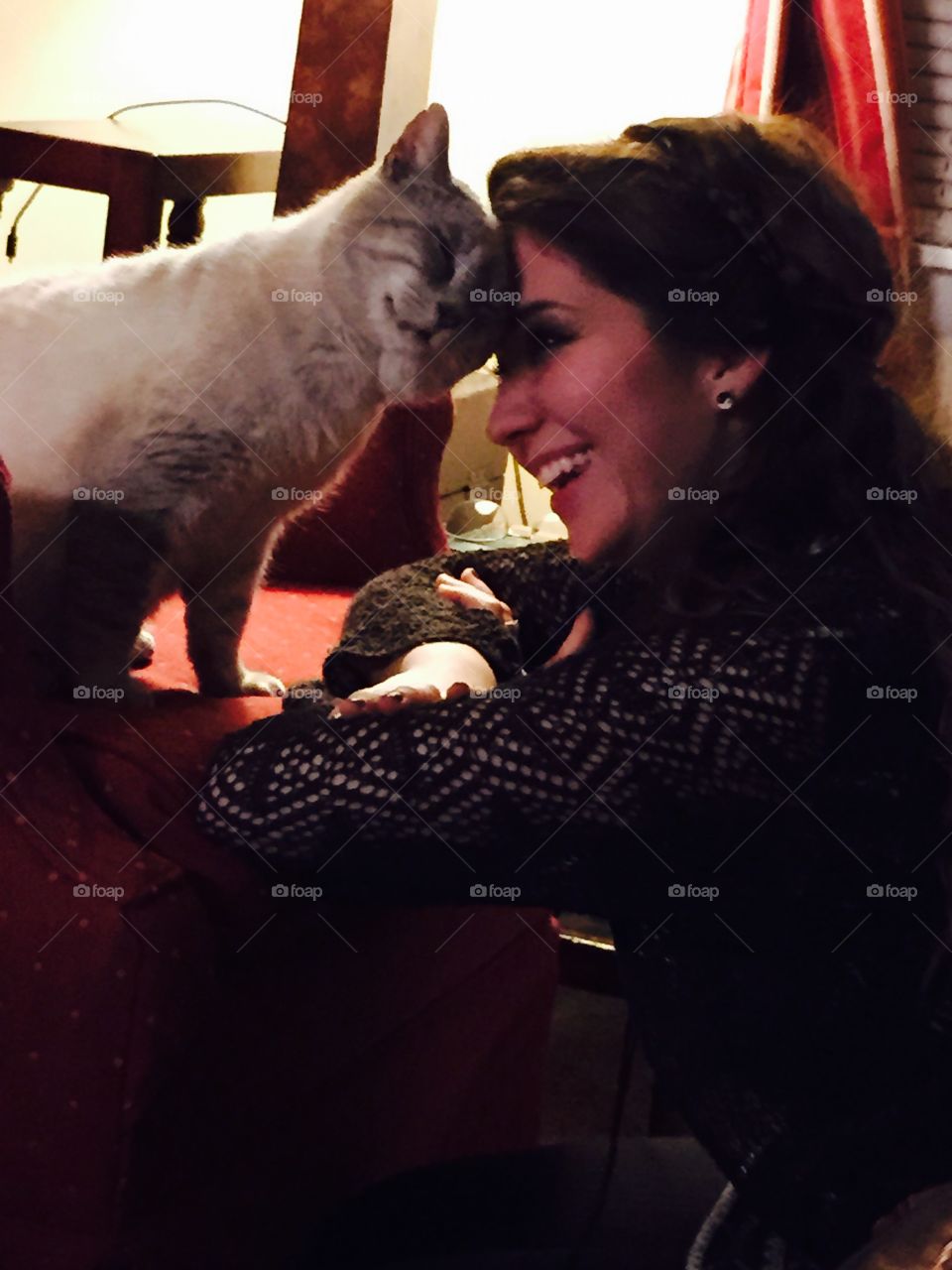 A precious moment with feline cat and girl.