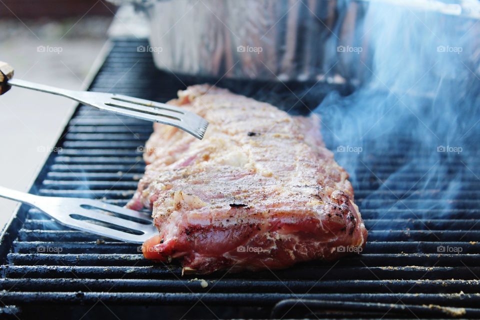backyard BBQ, smokin baby back ribs! Meat on the grill is the way to go.
