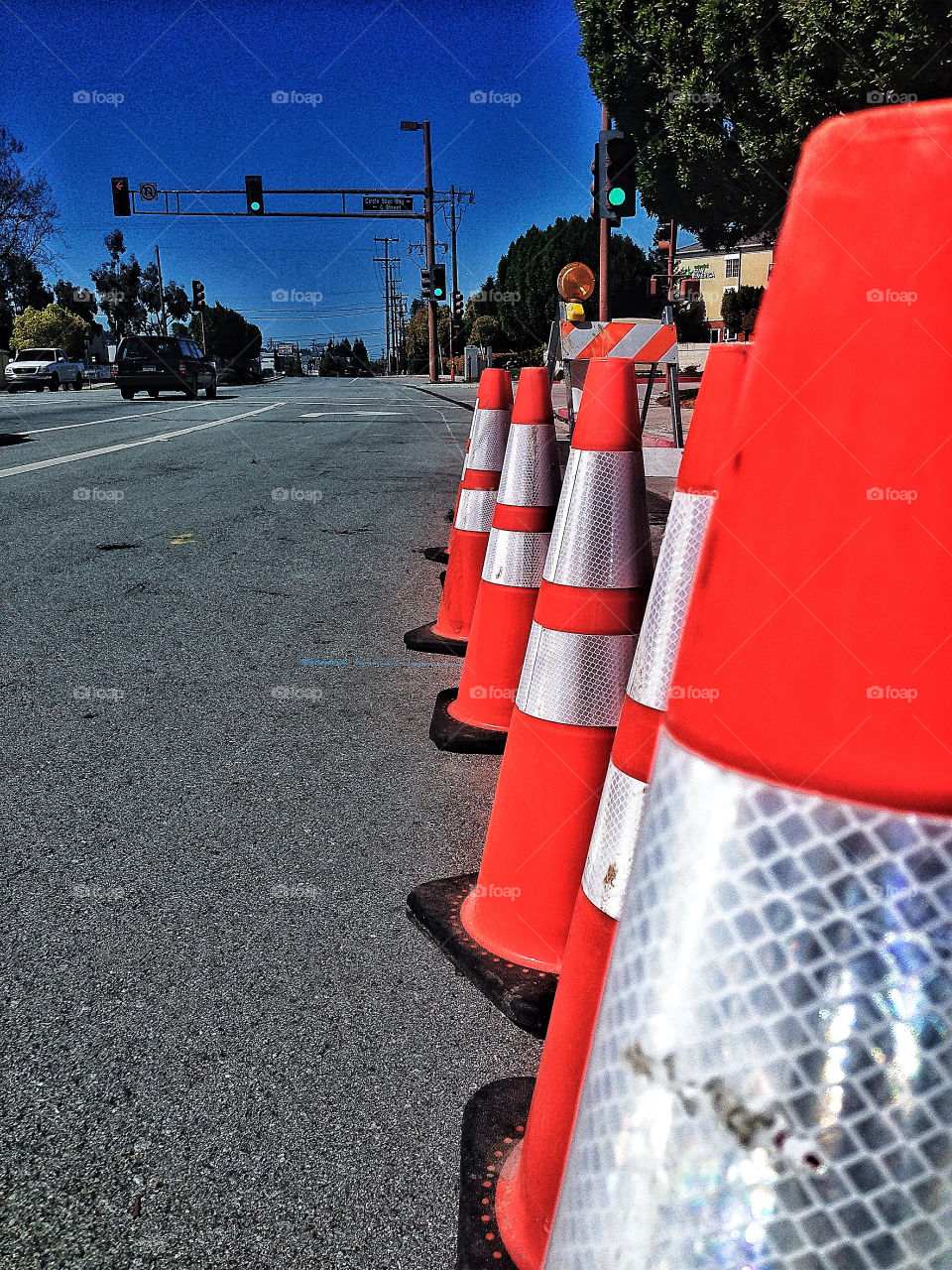 Bright orange traffic safety cones at a road construction site