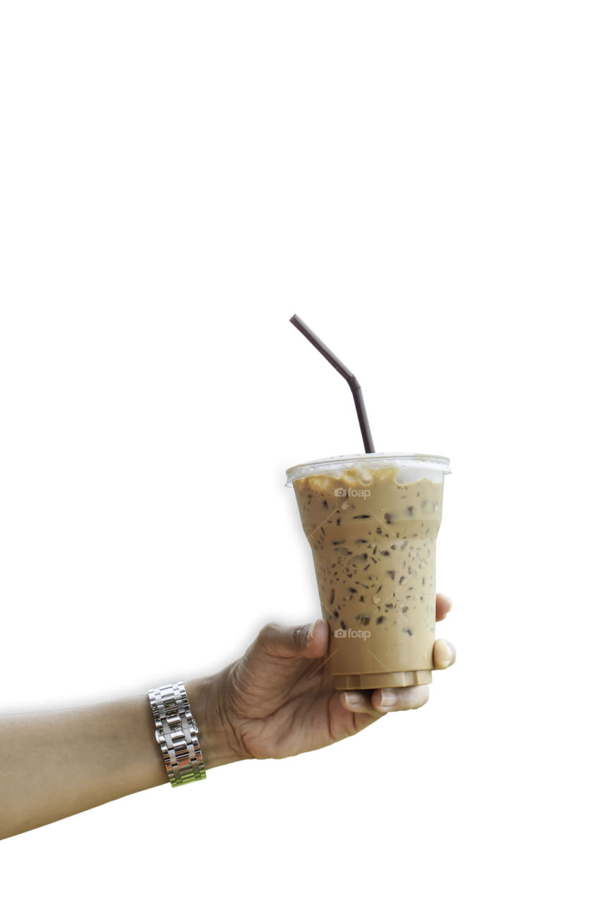 Hand holding iced coffee on a white background with clipping path.