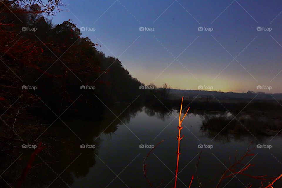 The campfire reflecting on a lonely stick