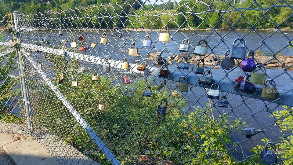 padlocks on fence overlooking Mississippi River