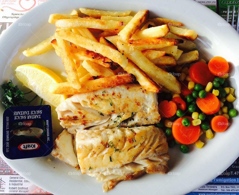 Broiled haddock with fries and veggies 