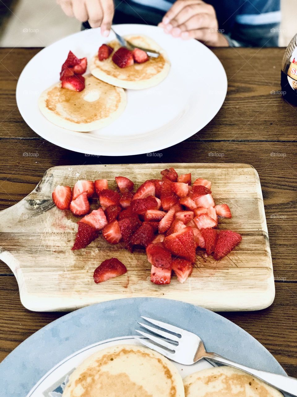 Breakfast time and healthy eating pancakes and strawberries 