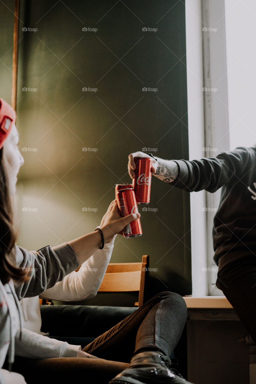 friends cheer with coca cola