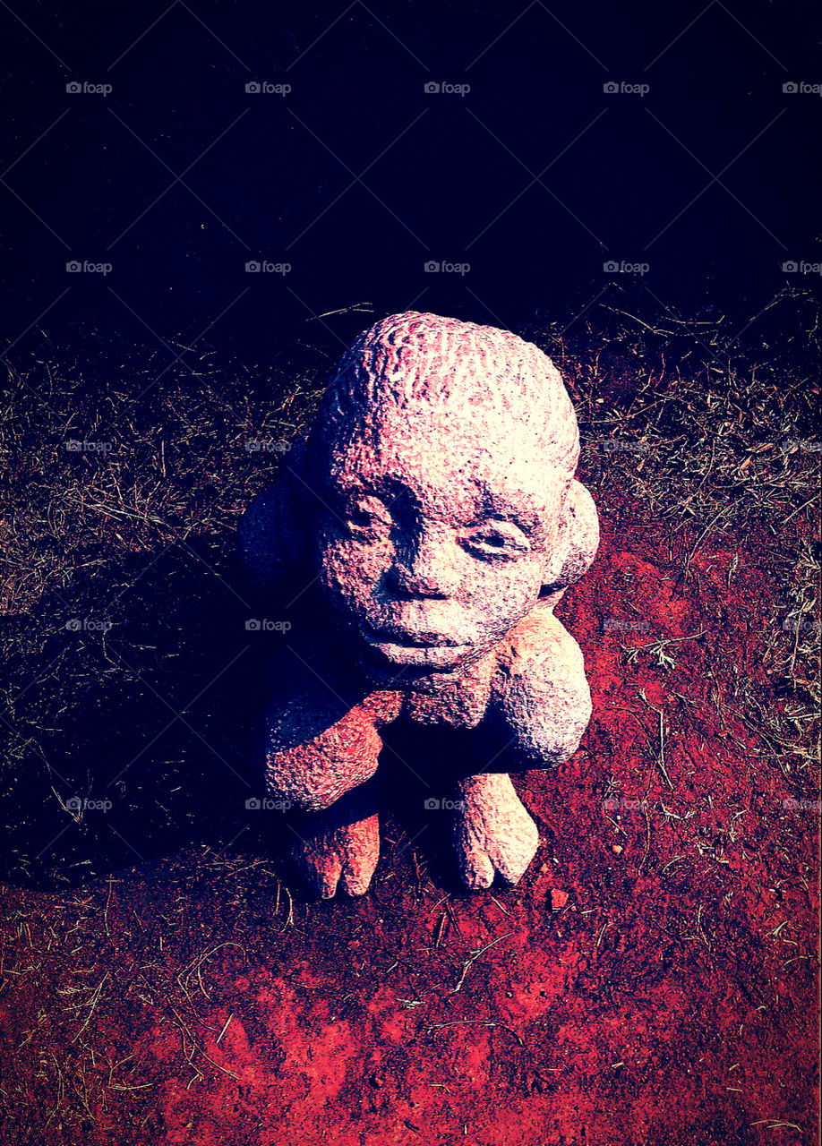 Amazing Art work done on concrete. Stone Art. Art of passion .An innocent boy sitting down. @ Kala bhawan "Santiniketan".