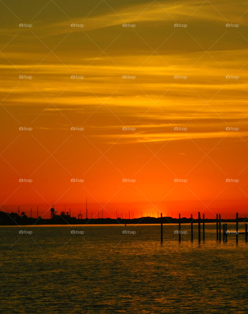 Silhouette of pier on the sea