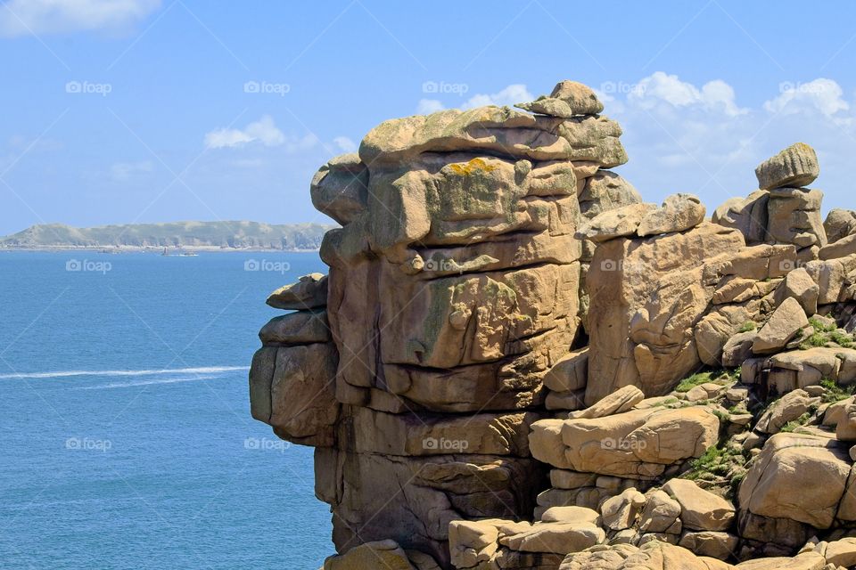 statue of a person on a rock