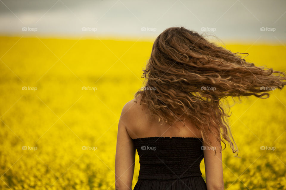 girl in a canola field
