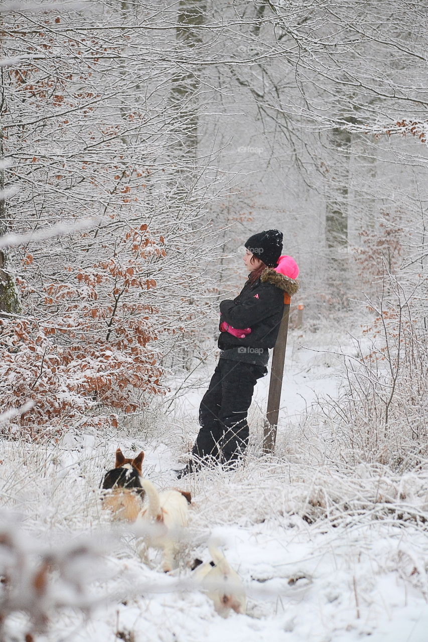 Girl resting during a walk with the dogs