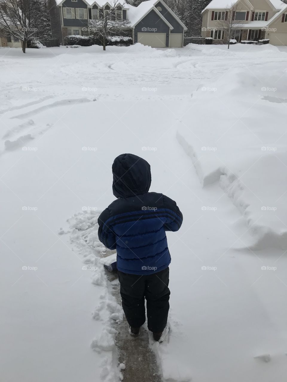 Boy shoveling 
