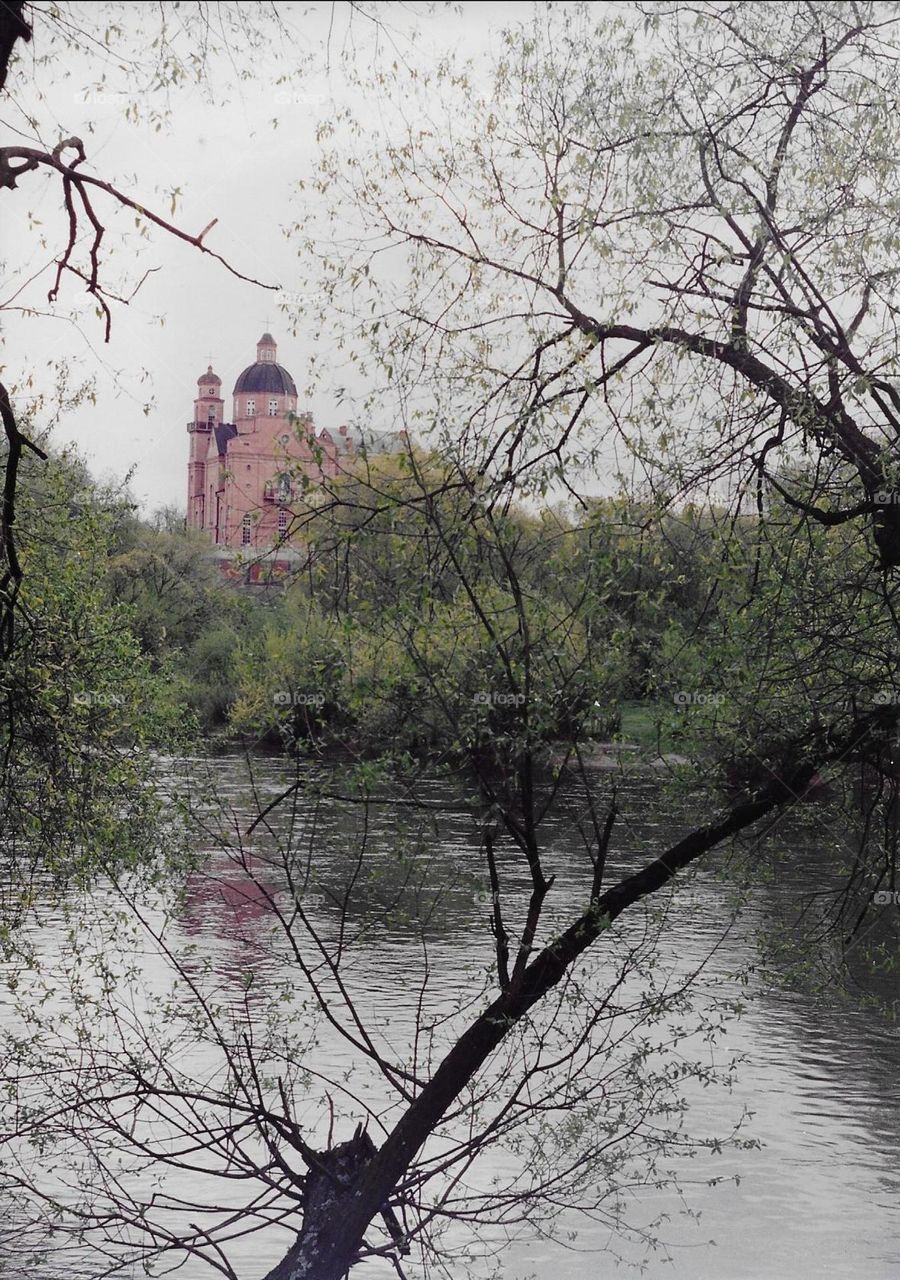 Catholic church on a river bank