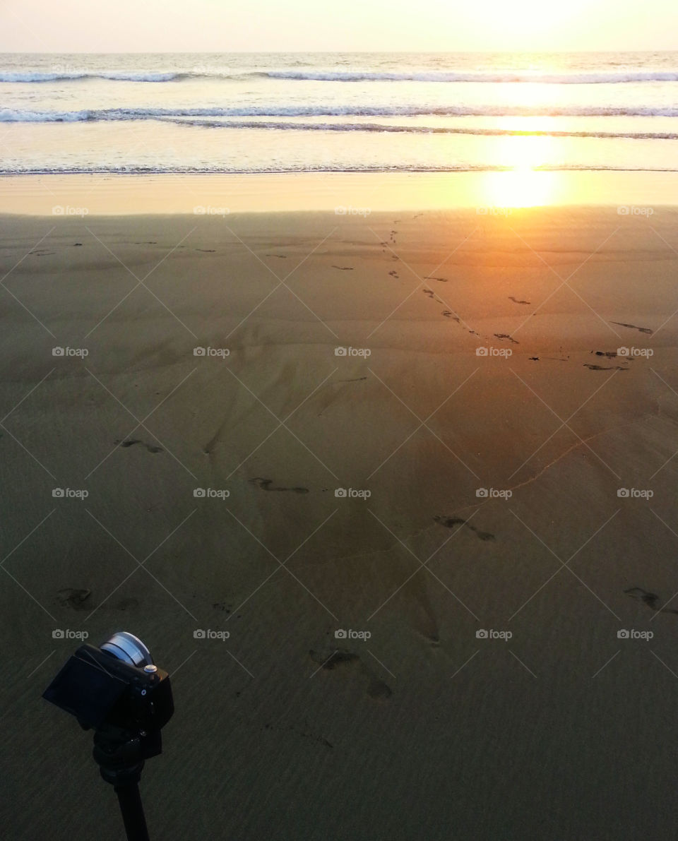 Camera meets ocean sunset