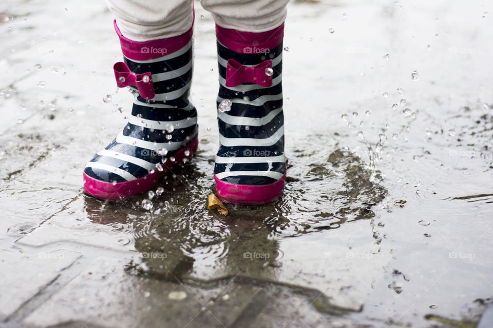 jumping in a muddy puddles