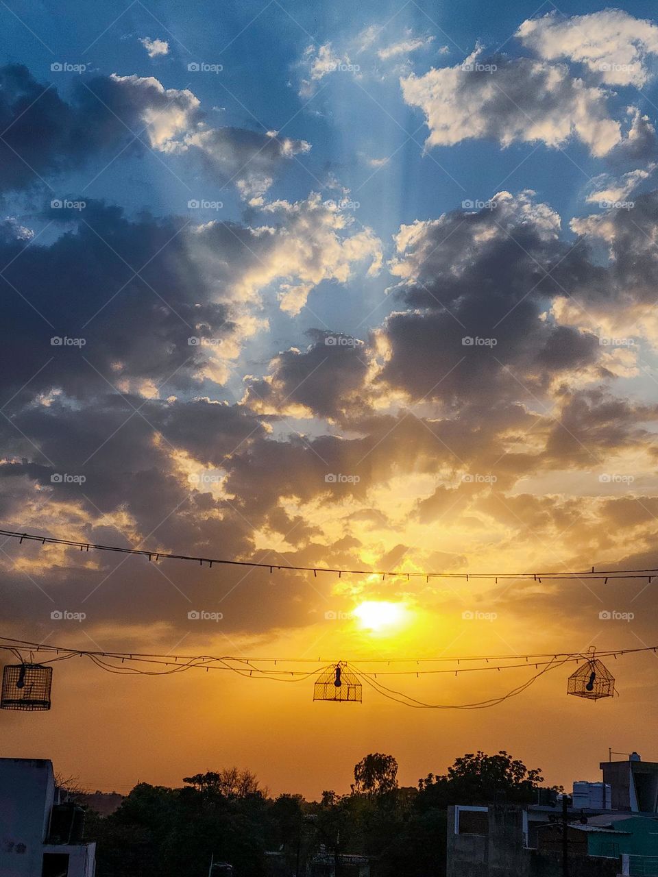 Beautiful sunset with warming rays coming through the clouds