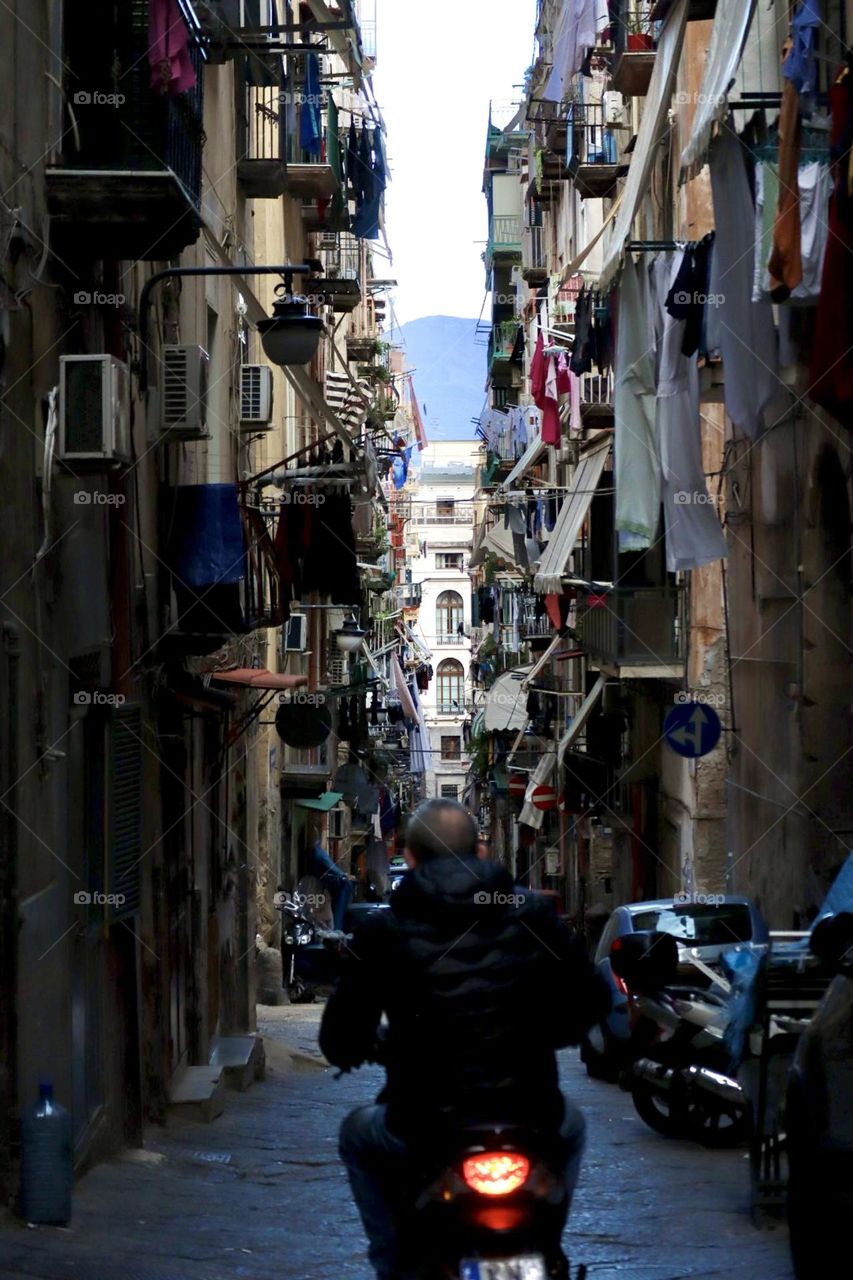Motorcycle in the streets of Napoli with volcano Vezuvio on background 