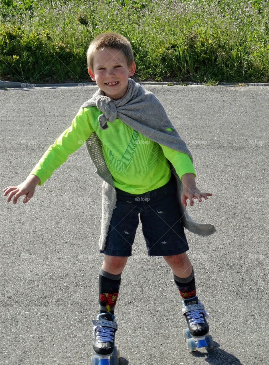 Young Boy On Roller Skates
