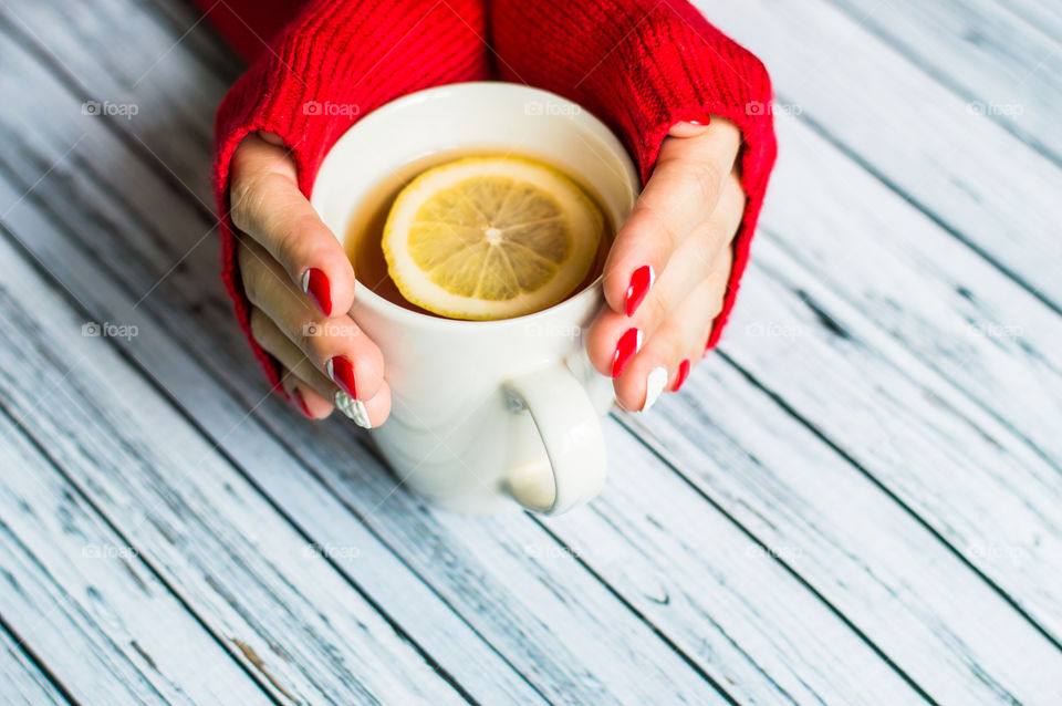 woman hand with cup of tea