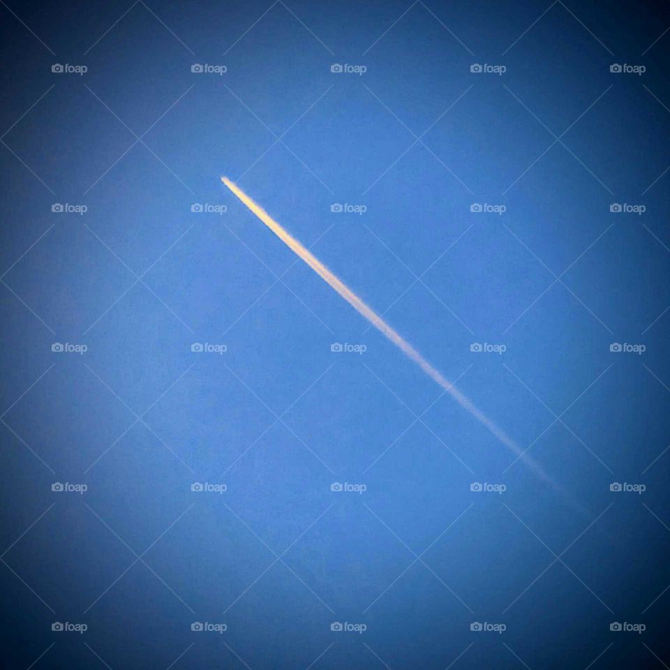 Comtrail Against a Deep Blue Sky