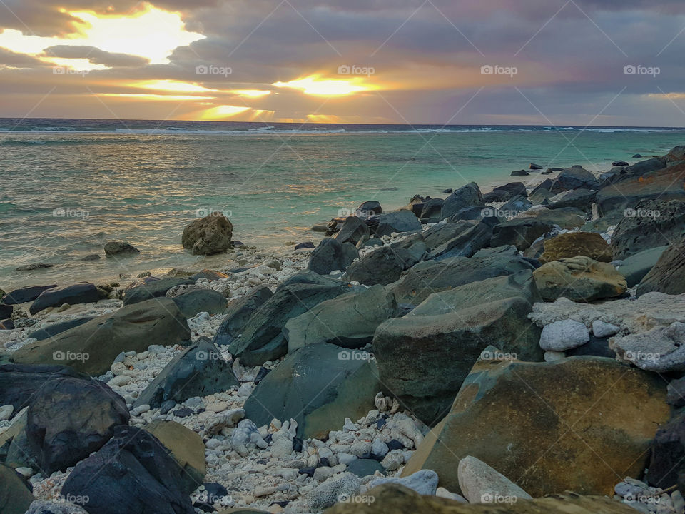 sunrise on the rocky beach